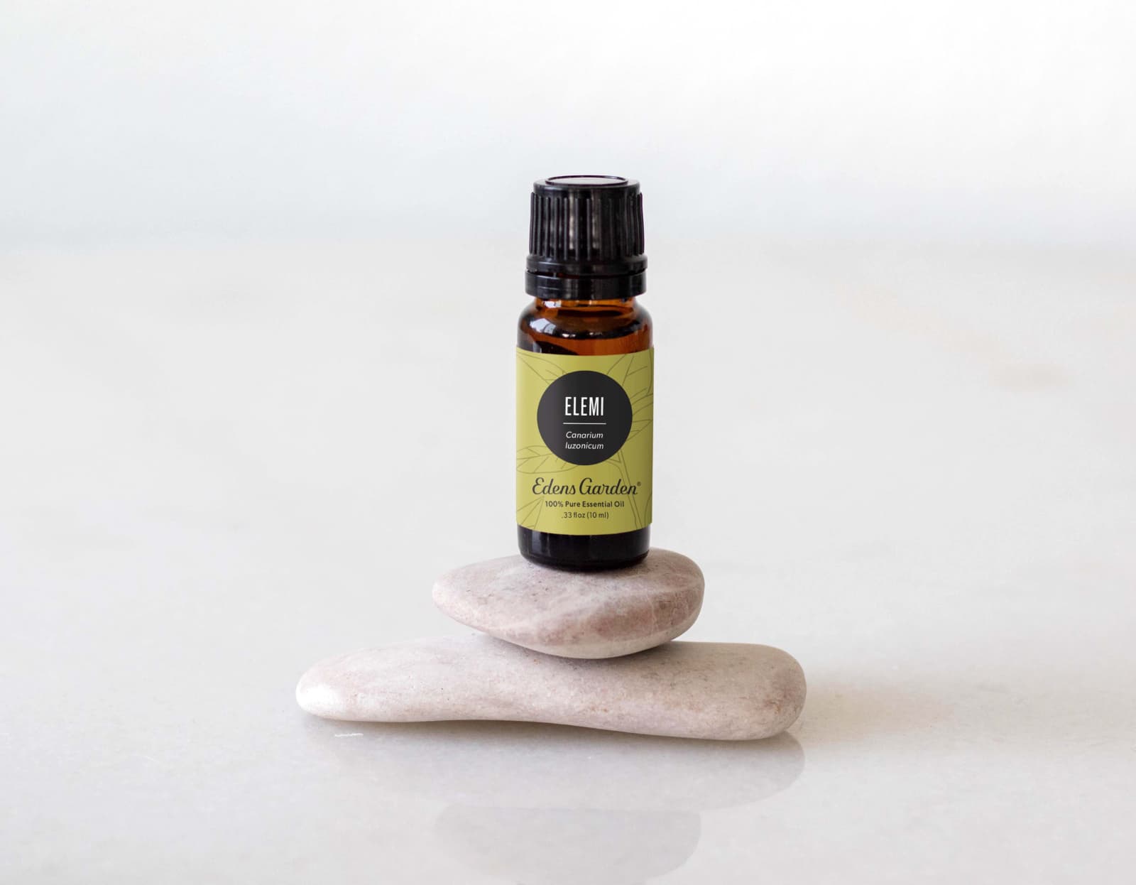 Essential oil on top of a stack of stones