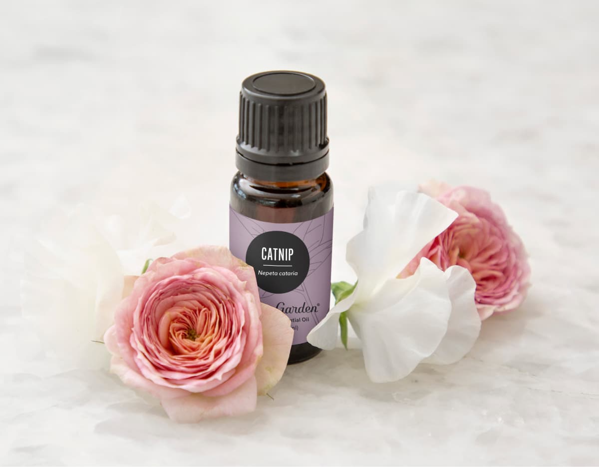 Essential oil surrounded by flowers