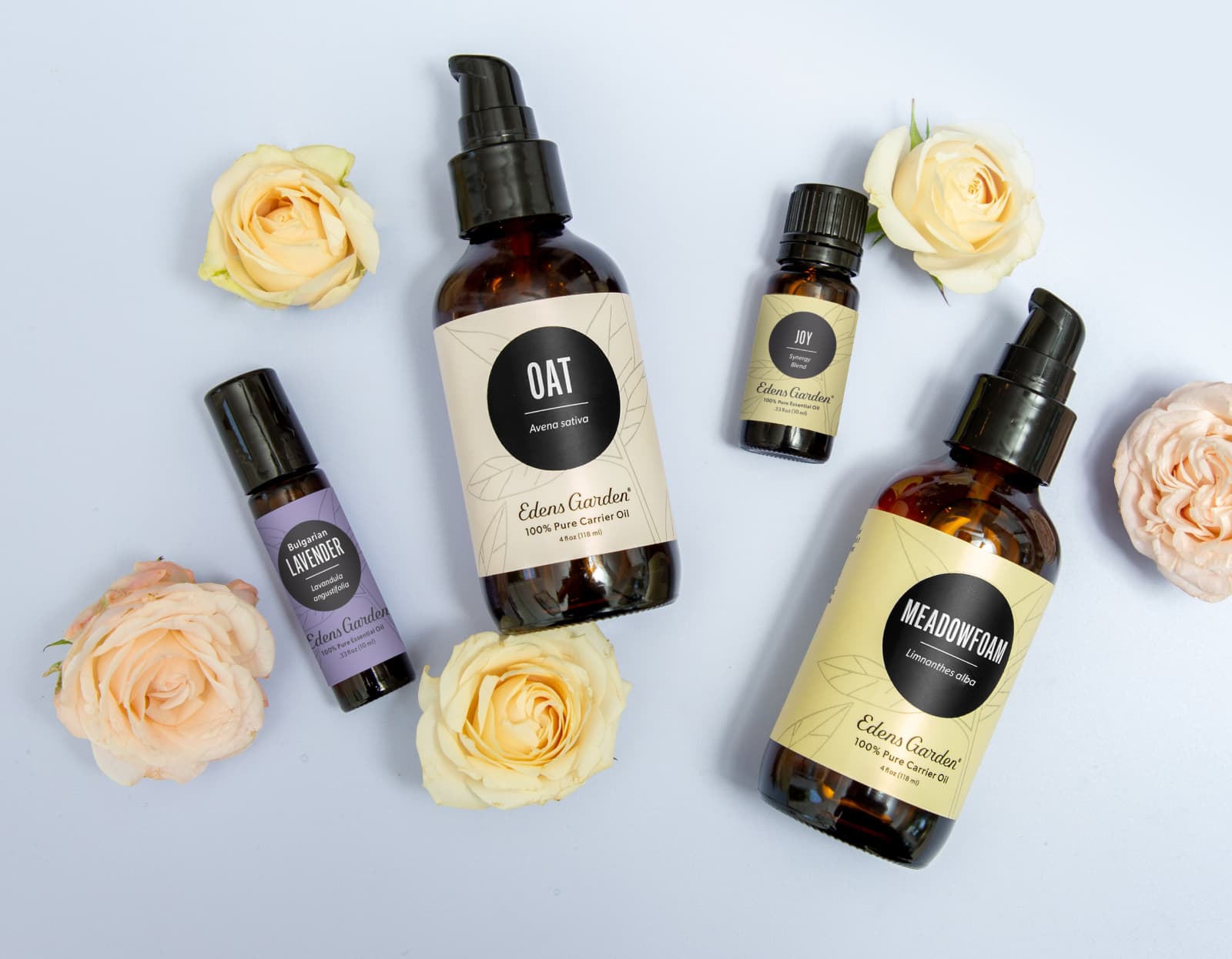 Lavender- Bulgarian roll-on, Joy synergy blend, Oat carrier oil and Meadowfoam carrier oil surrounded by flowers