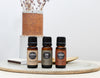 Three essential oils on a circular stone tray