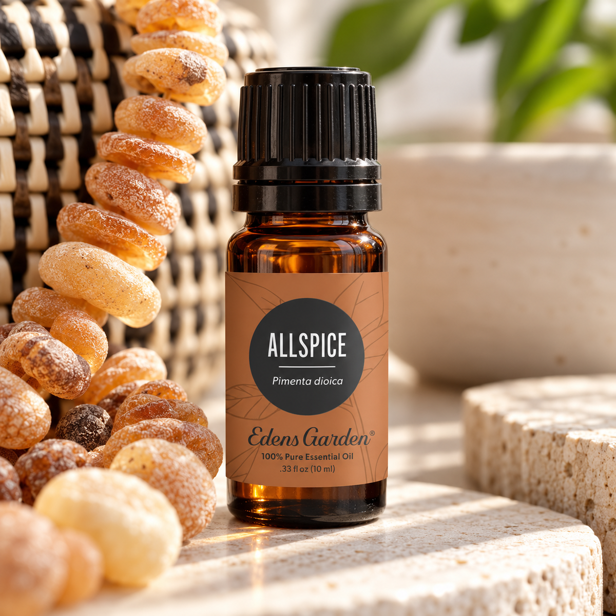 Edens Garden Allspice Essential Oil 10 ml amber glass bottle with natural woven textures and warm botanical accents in soft sunlight.