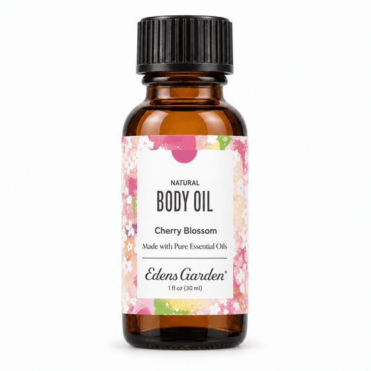 Edens Garden Cherry Blossom body oil in a 30 ml amber glass bottle with a black ribbed cap and a floral label, on a white background.