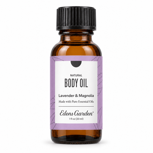 Edens Garden Lavender & Magnolia body oil in a 1 fl oz amber glass bottle with a black ribbed cap and a lavender and white label.