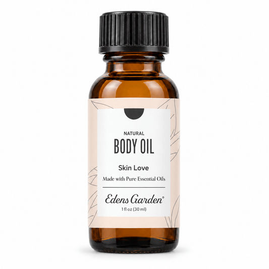 A 1 fl oz amber glass bottle of Edens Garden Natural Body Oil with a black ribbed cap and a beige label, shown on a plain white background.