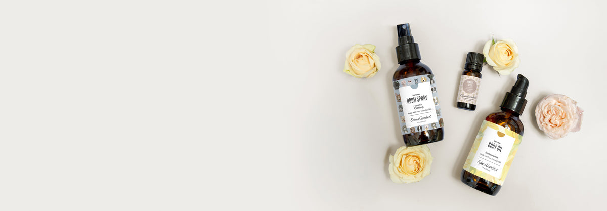Flowers with bottles of essential oil