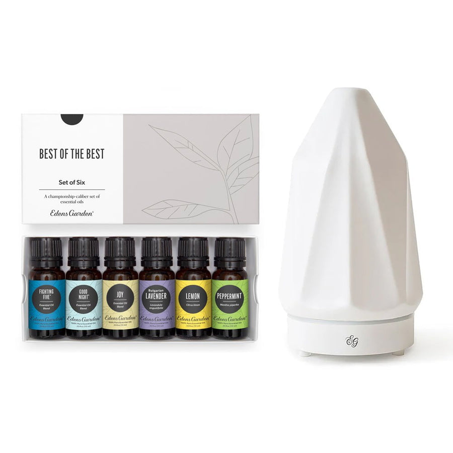 Set of six essential oil bottles with a diffuser on a white background