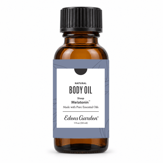 An amber glass bottle of Edens Garden Natural Body Oil with a black ribbed cap and a white label featuring a gray side panel. The label reads 'Natural Body Oil', 'Sleep Melatonin', and 'Edens Garden'.