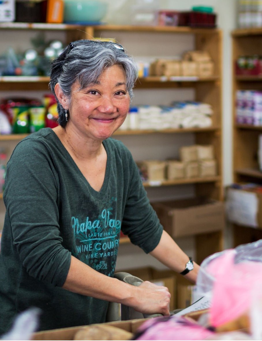 A volunteer helping the Feeding America organization