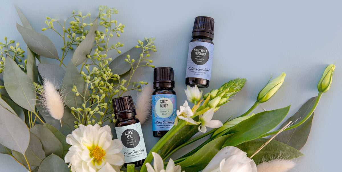 A bouquet of flowers and three essential oils
