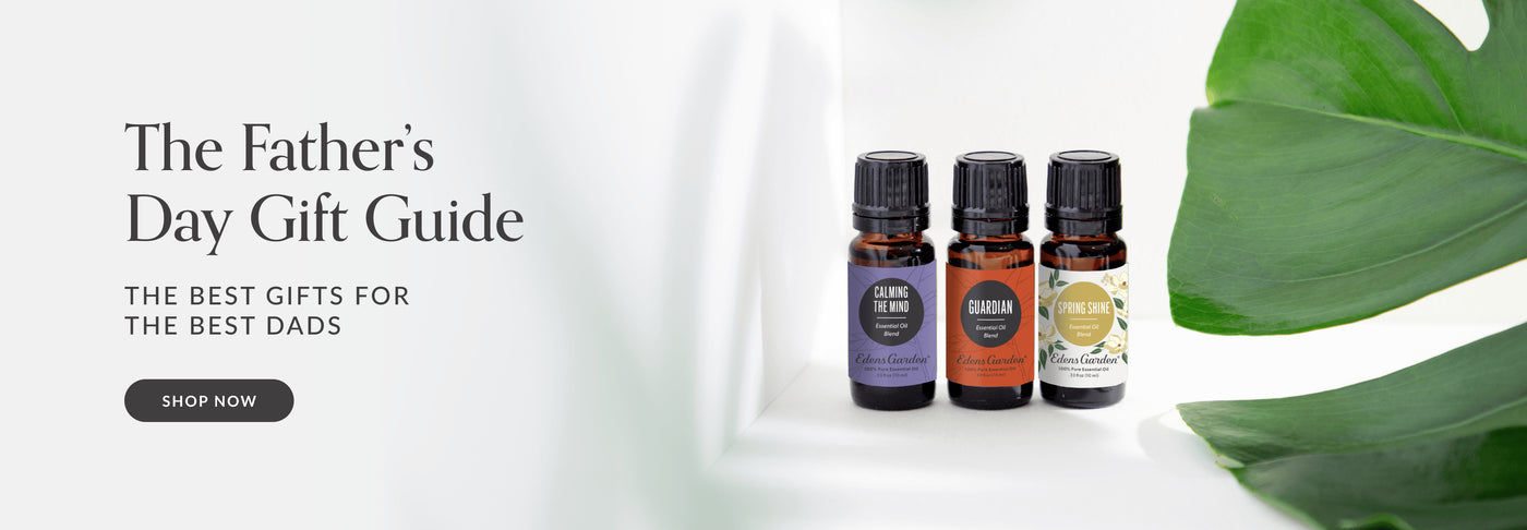Three essential oil bottles with labels on a white background, part of a Father's Day gift guide advertisement.