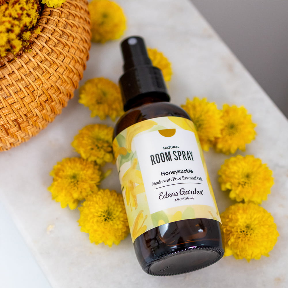 Edens Garden Honeysuckle floral Room spray bottle with yellow flowers on a marble surface
