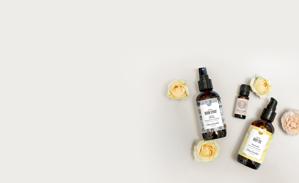 Flowers with bottles of essential oil