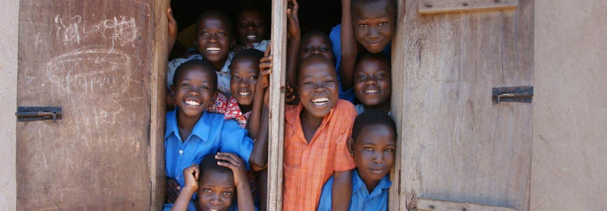 A promotional image of children for One Atta Tiime organization