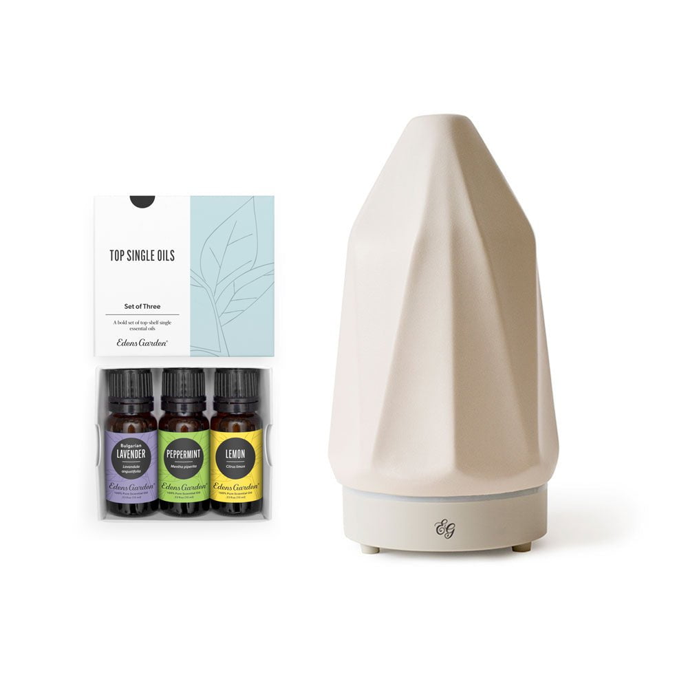 Beige diffuser with essential oil bottles and packaging on a white background