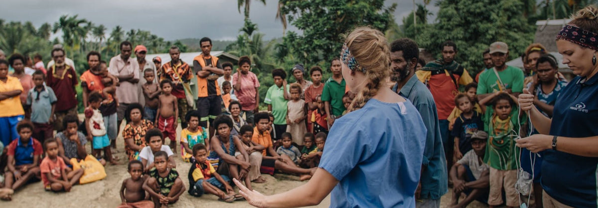A promotional image of someone ministering to a group of people for the YWAM organization