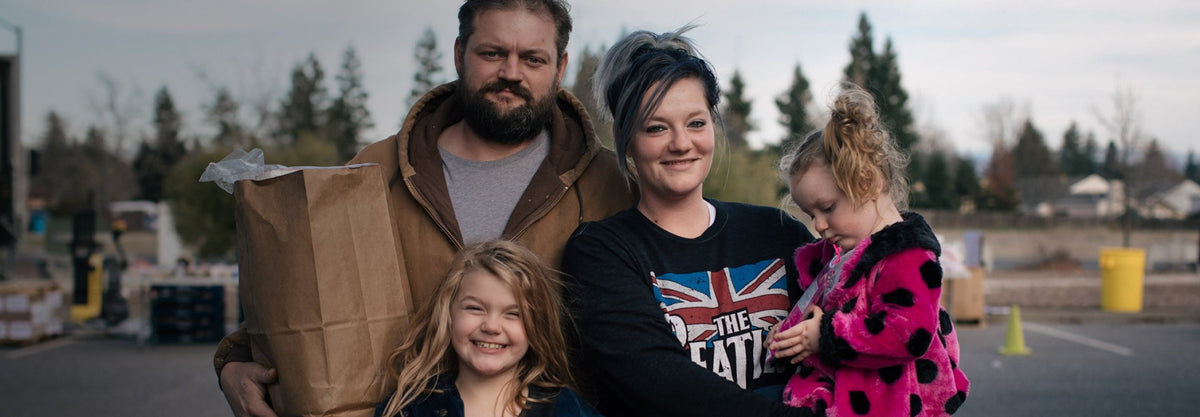 A promotional image of a family for the Feeding America organization