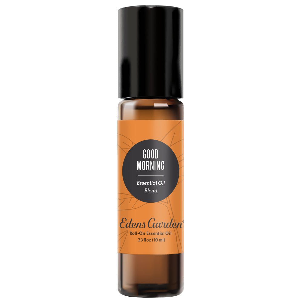 A roll-on bottle of Edens Garden Good Morning Essential Oil Blend with black cap and orange label.