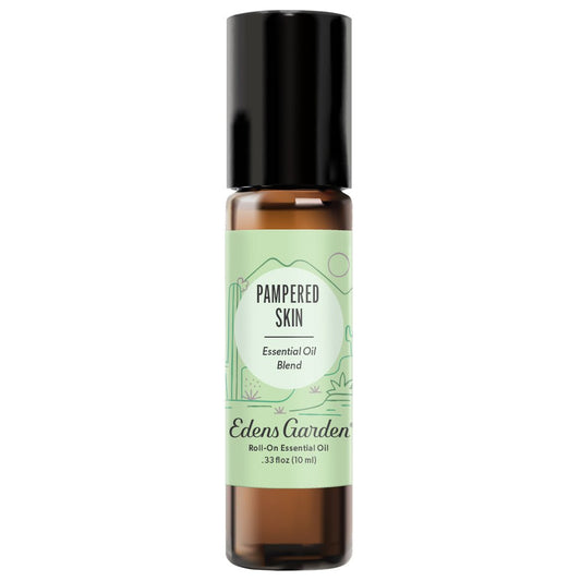 A clear glass roll-on bottle with a black cap labeled 'Pampered Skin Essential Oil Blend' by Edens Garden.