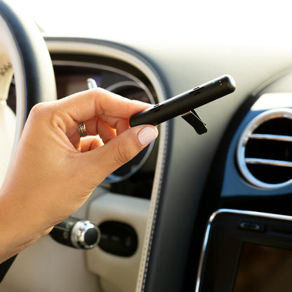 Aromaride essential oil car diffuser - person adding Aromaride essential oil car diffuser by Edens Garden to air vent 